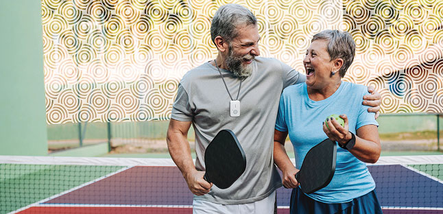 Man wearing MGMini and woman wearing MGMini Lite